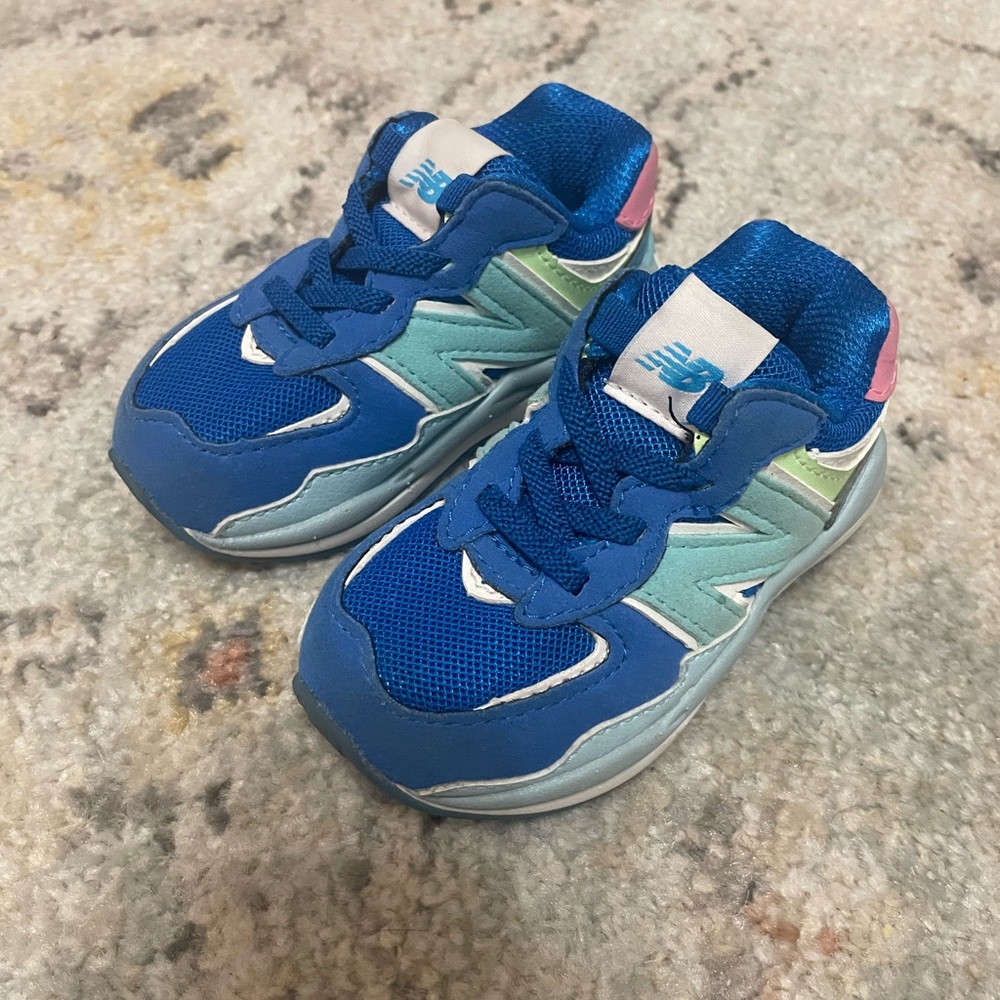 New Balance Kids Sneakers in Blue with Pink and Green Accents